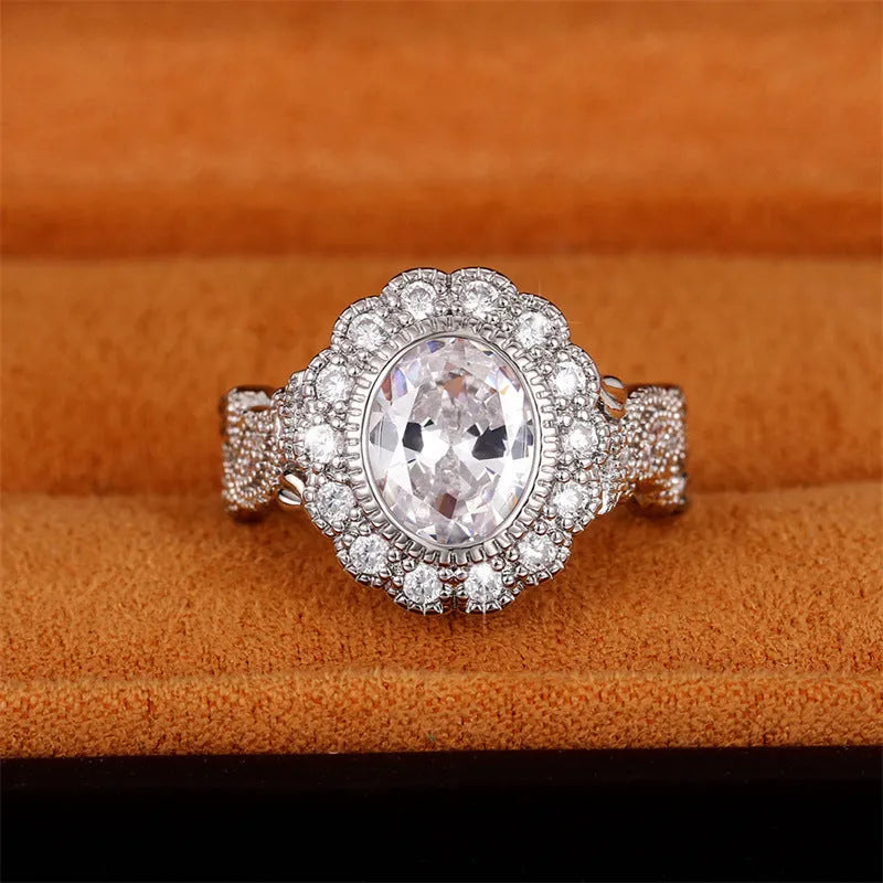Geometric white gold plated copper ring with round zircon centrepiece on finger