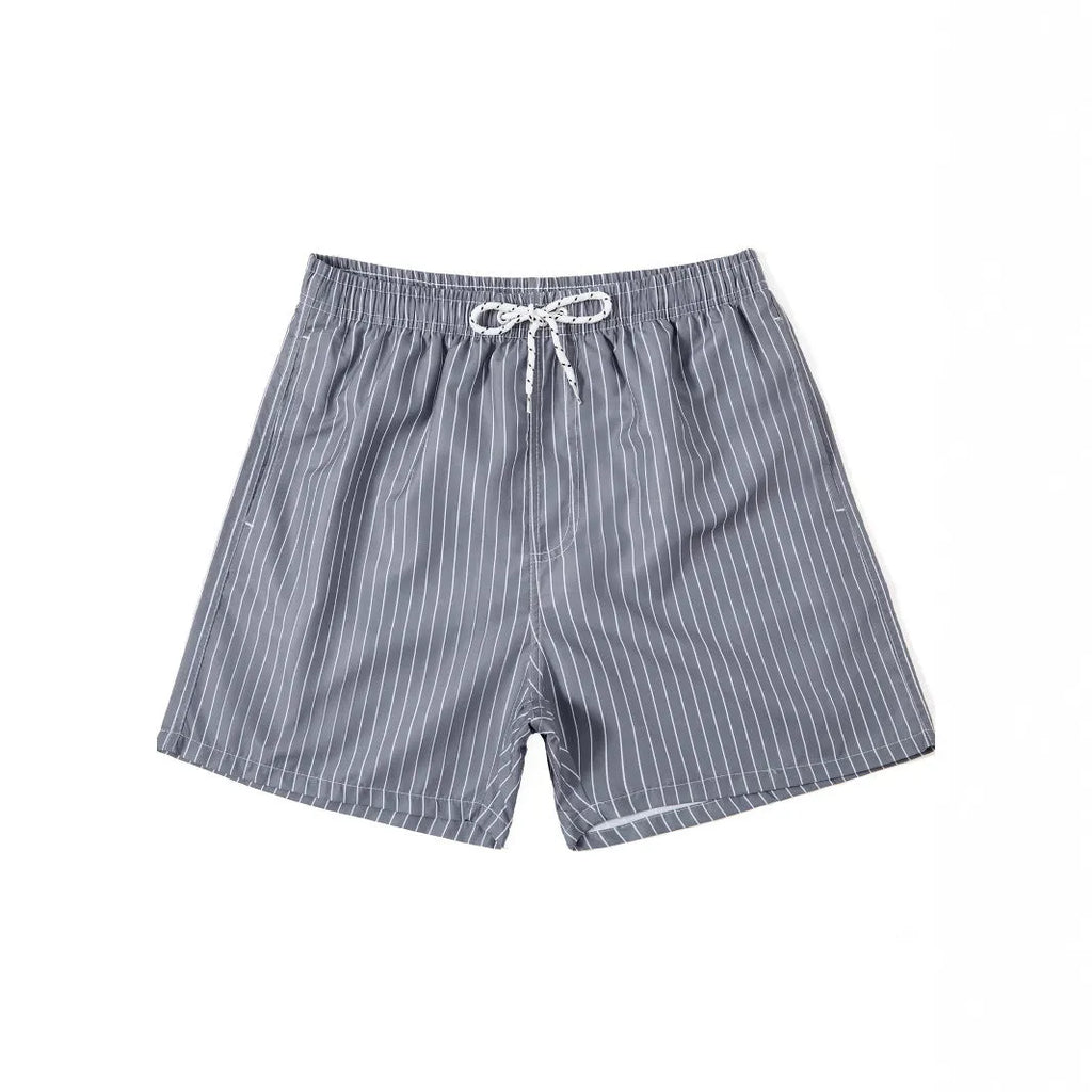Polyester fibre striped beach shorts with triangle lining in navy blue, straight leg opening