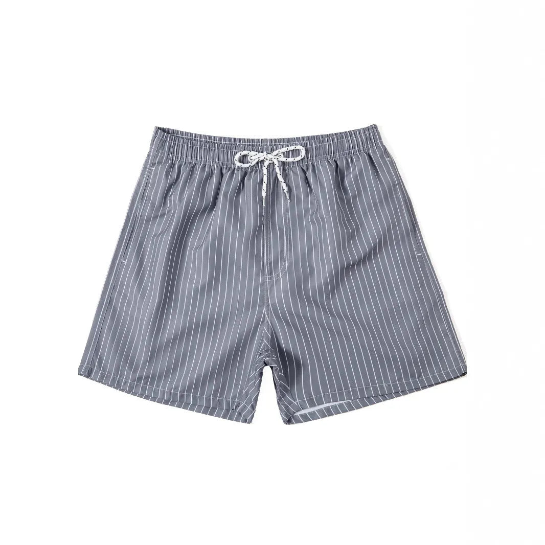 Polyester fibre striped beach shorts with triangle lining in navy blue, straight leg opening