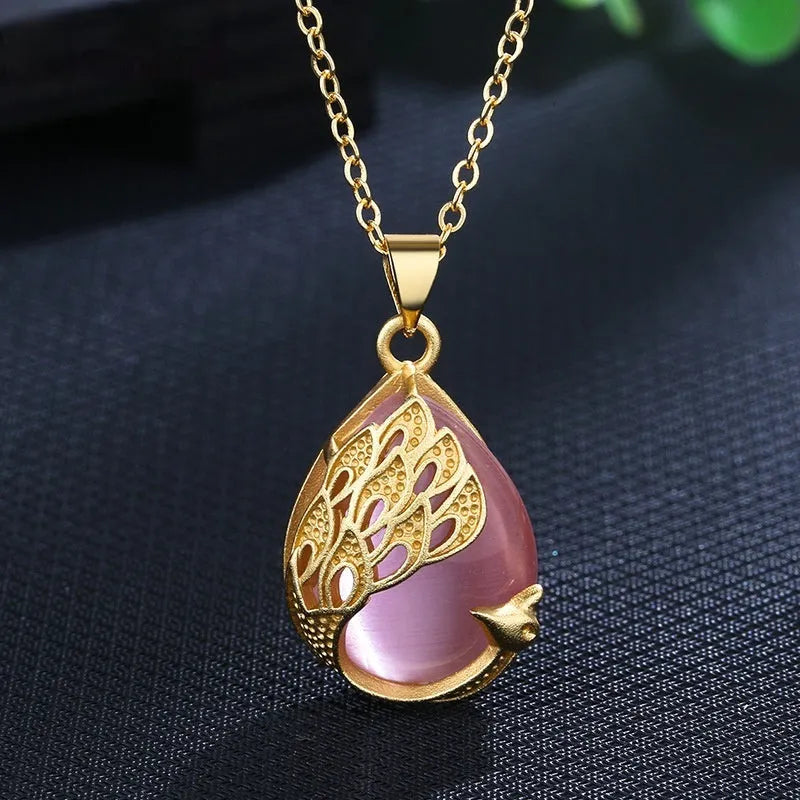 Green chalcedony imitation crystal peacock pendant on copper electroplated frame, single pendant style without chain, simple fu character design