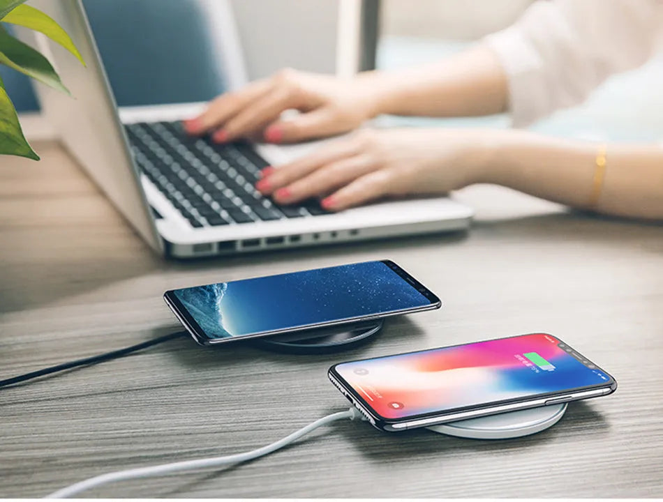 Glass disc wireless charger showing black and white colour options with charging indicator