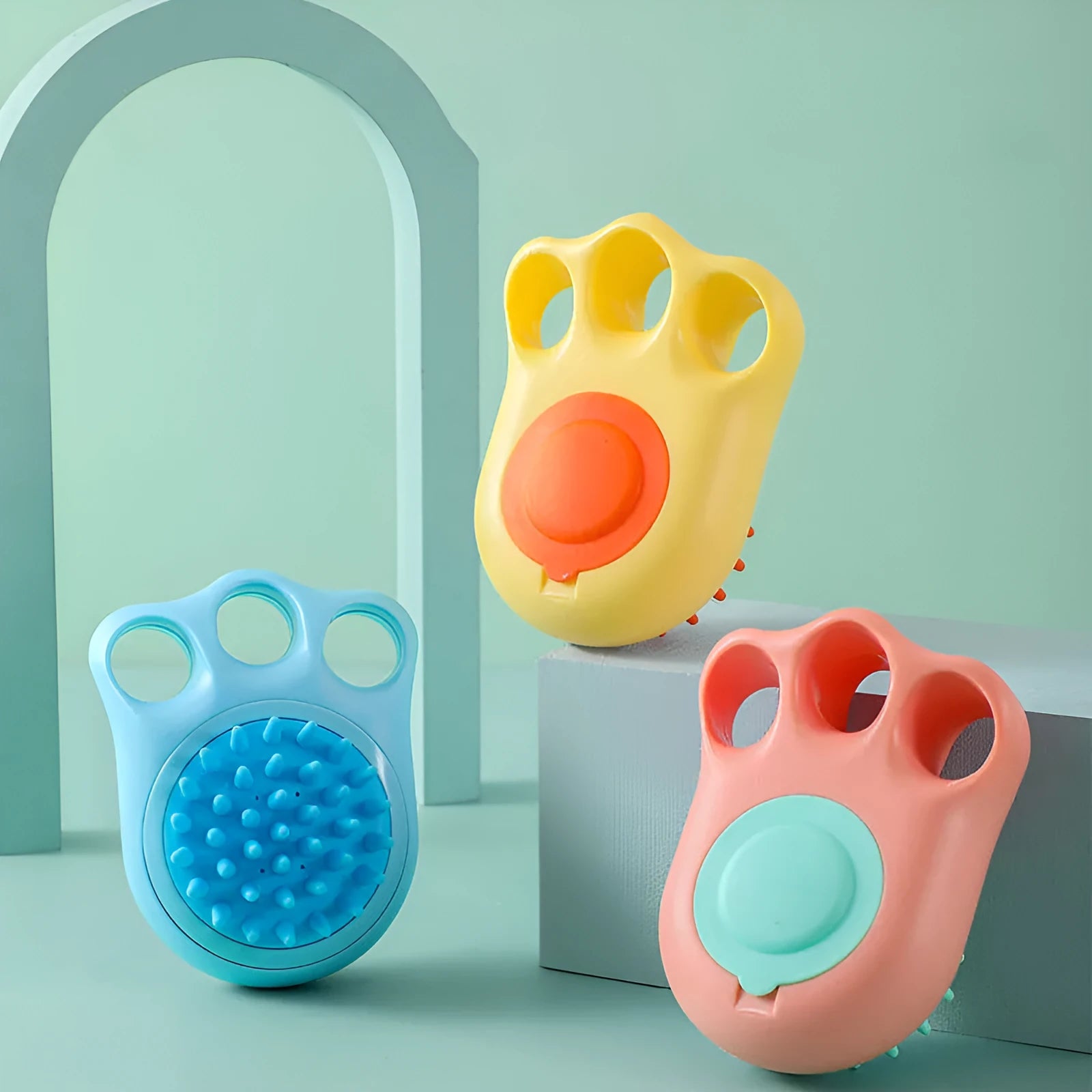 A blue cat claw-shaped pet bath brush for grooming and massaging dogs or cats during washing.