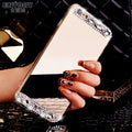 Gold rhinestone decorative silicone back cover case for a Huawei smartphone on a table.