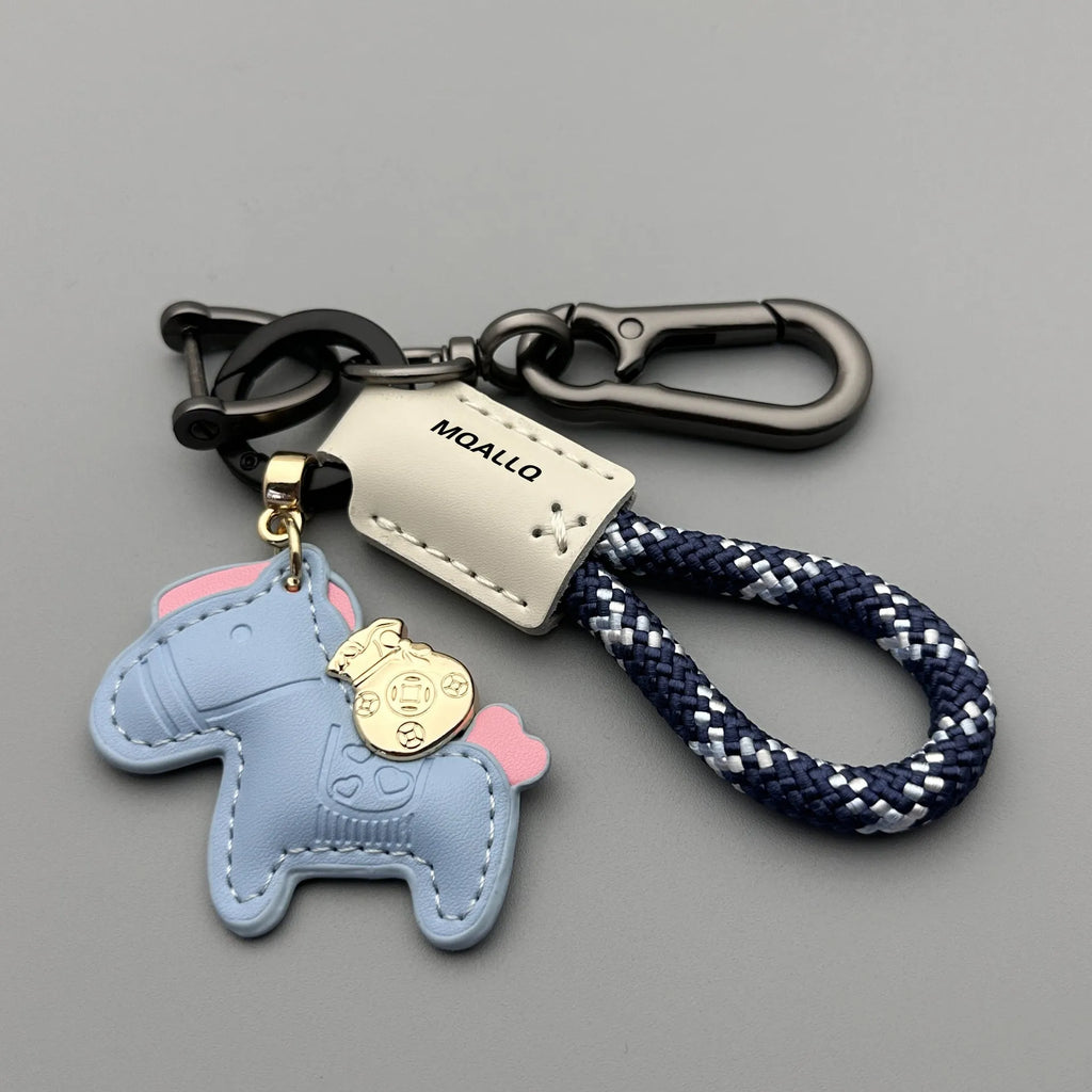 Handmade brown cowhide leather key ring pendant with a gold-toned zinc alloy pony belt buckle and green flanelle rope.