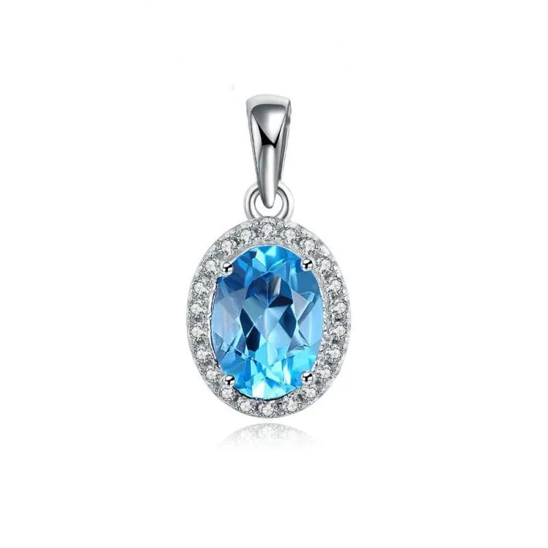 925 sterling silver geometric jewellery set with blue topaz gems showing earrings, ring, necklace, and pendant
