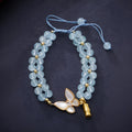 Women's aquamarine woven bracelet with butterfly design and 6mm stone beads