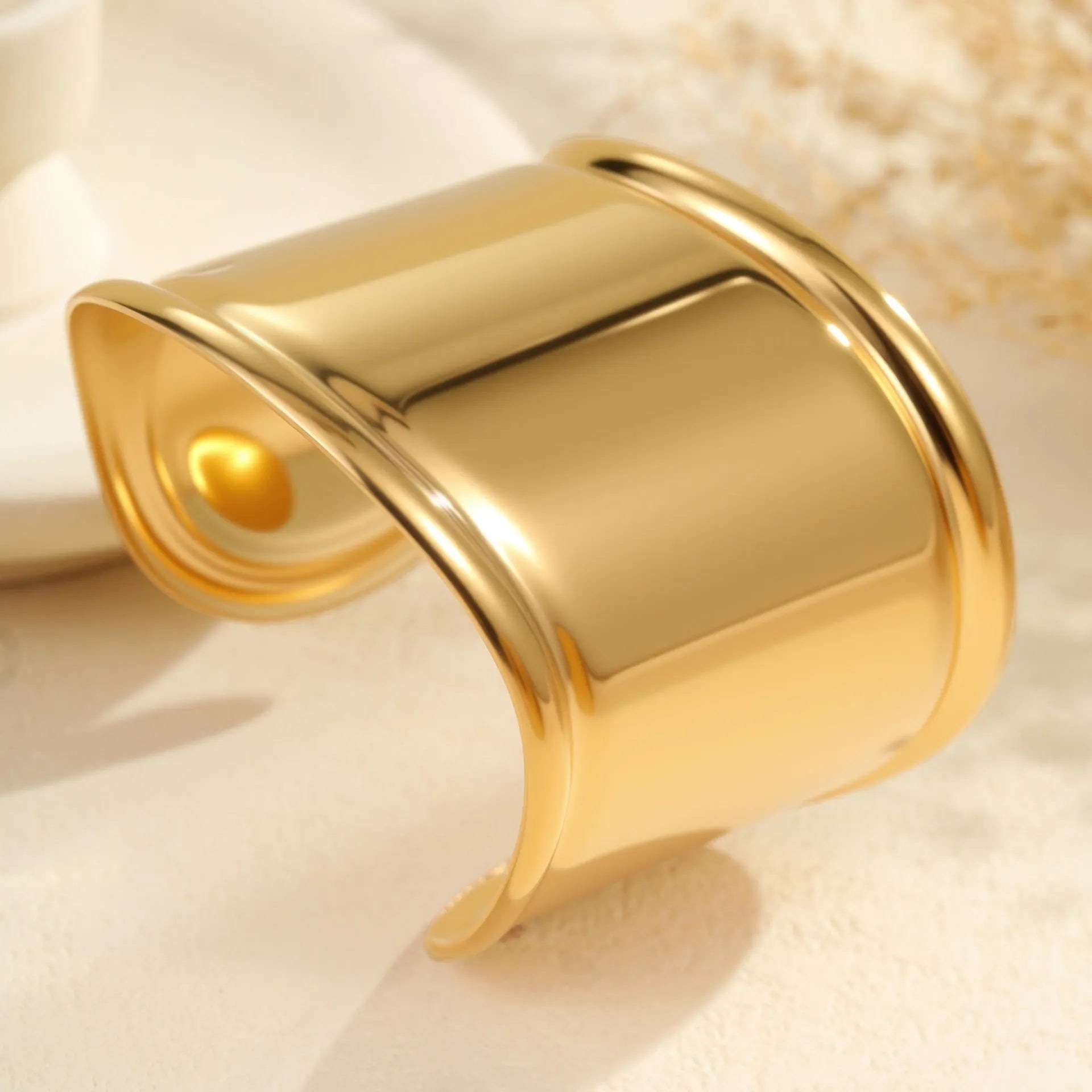 Women's gold plated stainless steel bracelet with wide geometric wave design and niche opening