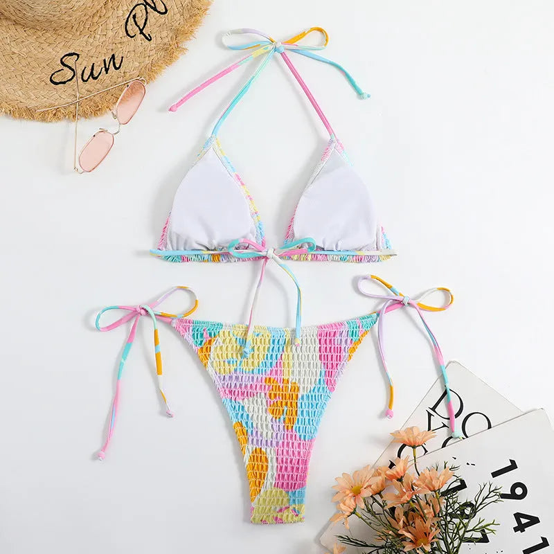 Women's floral print triangle bikini with smocking detail on the briefs, shown in multicolour.