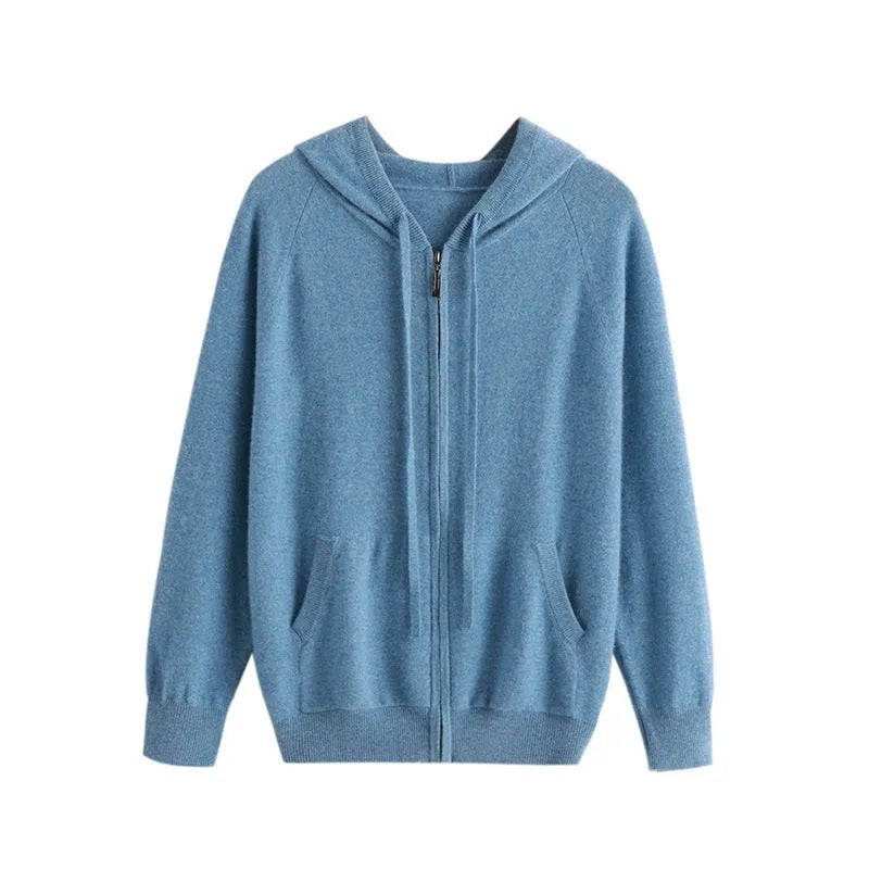Man wearing a haze blue hooded zip-front cashmere knit cardigan in a casual setting.
