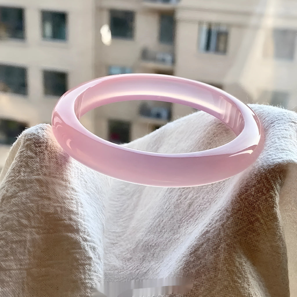 Natural agate wide tyre bracelet showing pink stone beads with six size options from 52mm to 62mm internal diameter