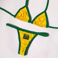 Women's yellow polyester bikini set with T-back bra and shorts-length bottoms on a mannequin.