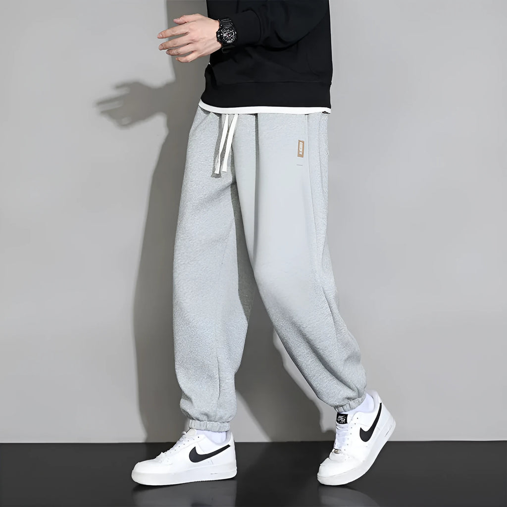 Men's loose fit cotton-polyester sports trousers in grey with elasticated waistband