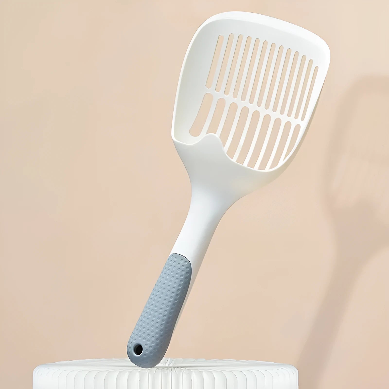 White plastic cat litter scoop with base tray measuring 29.5cm