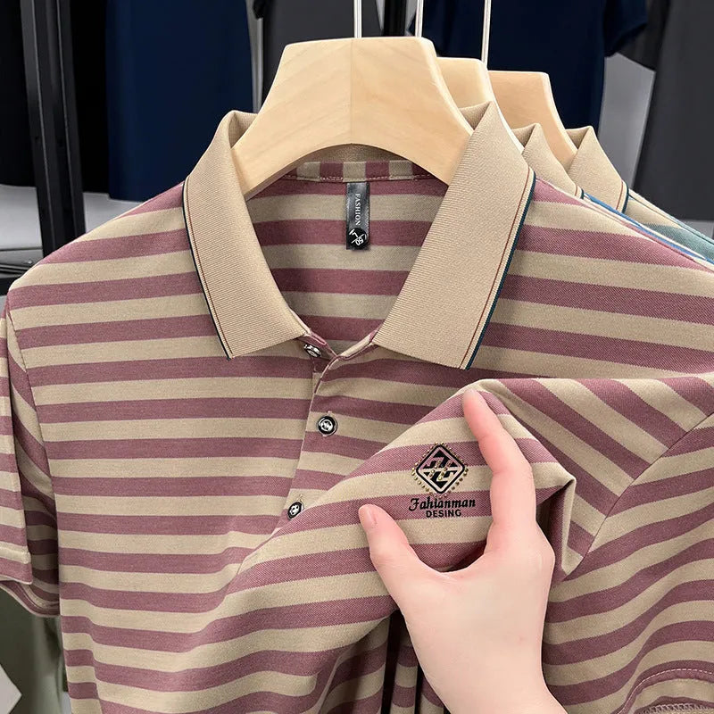 A man wearing a red striped casual t-shirt with a mosaic pattern detail on the fabric.