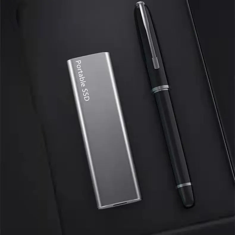 Ultra-thin metal mobile SSD expansion hard drive in red, shown with capacity options up to 30TB.
