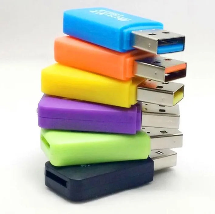 Mini USB TF card reader with inserted 16GB microSD card and separate SD card adapter.