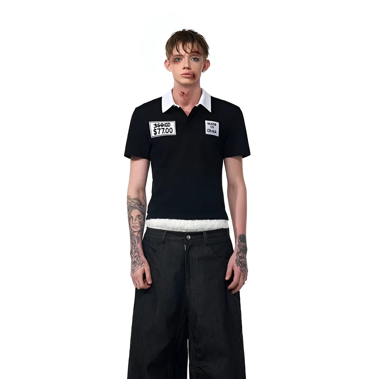 Black slim fit men's short sleeve polo shirt with embroidery detail on a hanger.