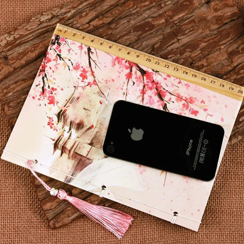 Azalea coloured Chinese style notebook with thread binding, showing its 208mm by 140mm size.