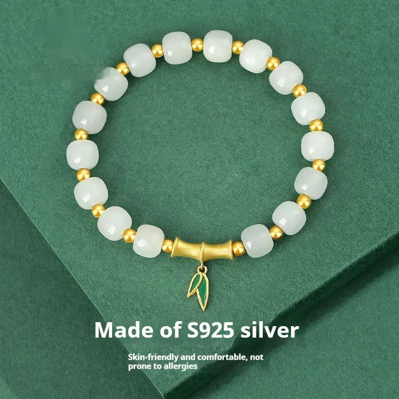Sterling silver bracelet with gold Hetian jade beads and bamboo leaf charms