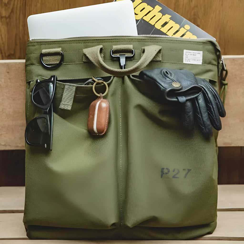 Marden canvas crossbody messenger bag in military green showing laptop compartment and shoulder strap