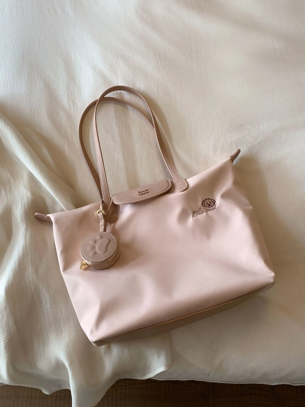 Beige Oxford cloth large capacity tote bag with shoulder strap showing horizontal square shape and sandwich pocket