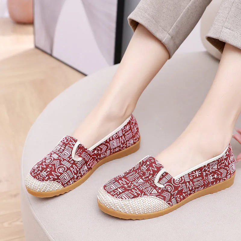 Women's ethnic style cloth shoes with colour stitching, cotton lining, and flat heel in shallow mouth design