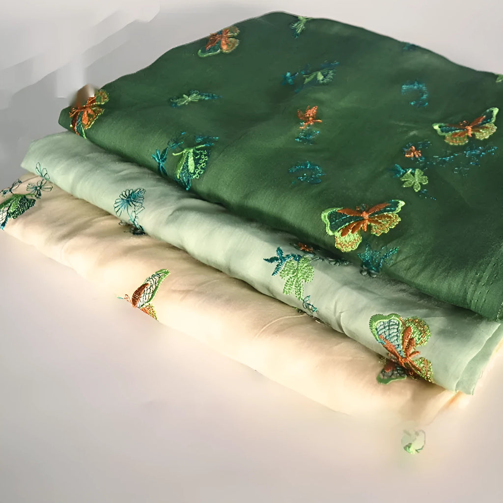 Pure ramie Hanfu fabric showing texture detail with beige, dark green, and grass green colour options