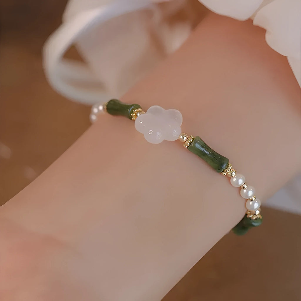 Chinese style olivine bracelet with Hetian jade and copper shell pearls featuring bamboo joint design