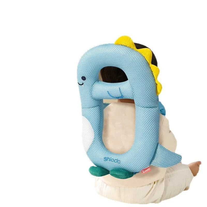 Baby wearing cartoon dinosaur anti-collision pillow for toddler fall protection