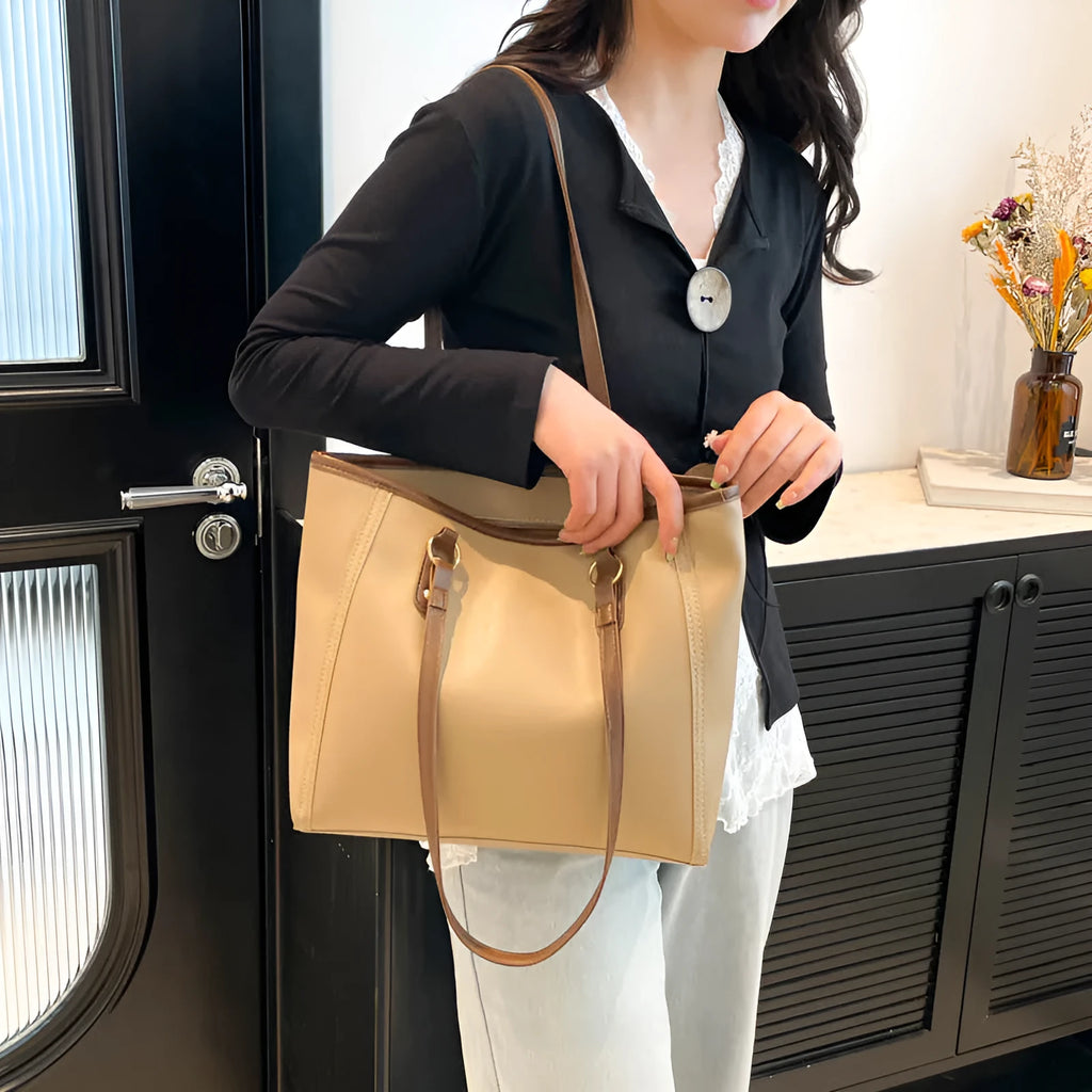 PU leather contrast colour tote bag with horizontal square shape and outer slit pocket.