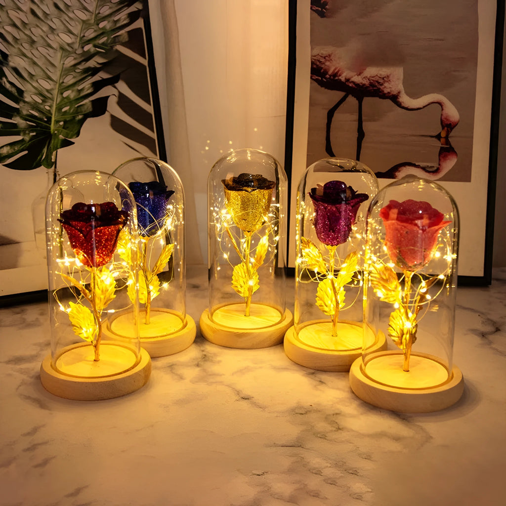 Red eternal rose in glass dome with warm white LED light string on bendable copper wire