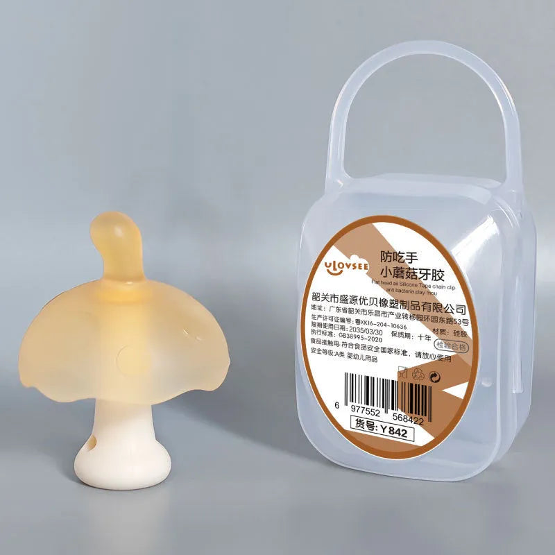 Small mushroom-shaped pink silicone gum charm in a transparent box with a delicate chain.