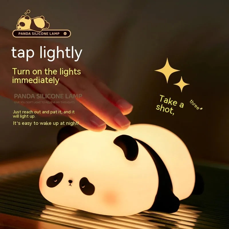 Cartoon panda silicone night light for kids with clap control on a bedside table