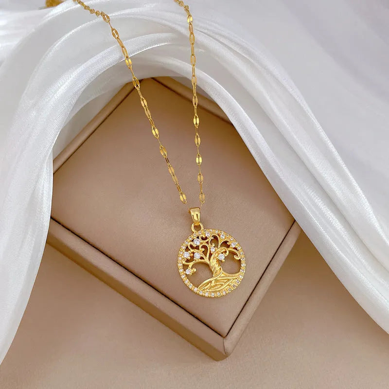 Gold-plated cross necklace with a mother pearl pendant, detailed rhinestones, and an adjustable lip chain.