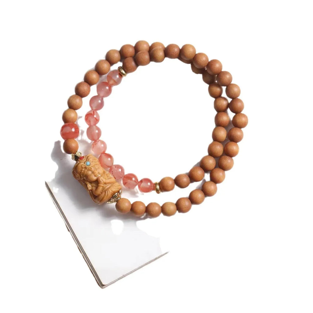 Brown wooden bracelet with sandalwood beads featuring South Red Zachilam and double circle design