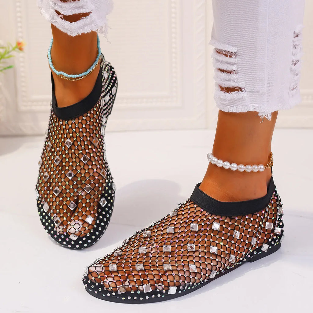Women's colourful rhinestone and white mesh flat sandals on a rubber sole.