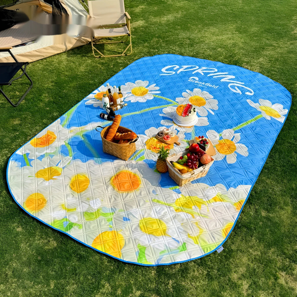 Waterproof outdoor picnic mat in a Four Seasons Series colour, shown on grass.