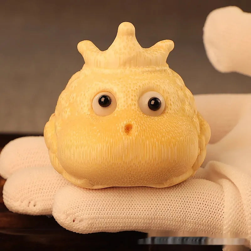 Solid bamboo carving of a Crown Princess toad ornament with live eye detail in a cute style.