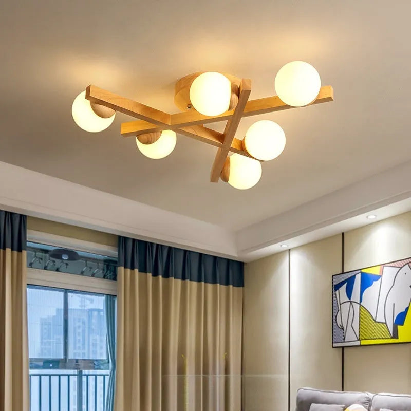 Wooden style modern Nordic ceiling light with three neutral light heads.