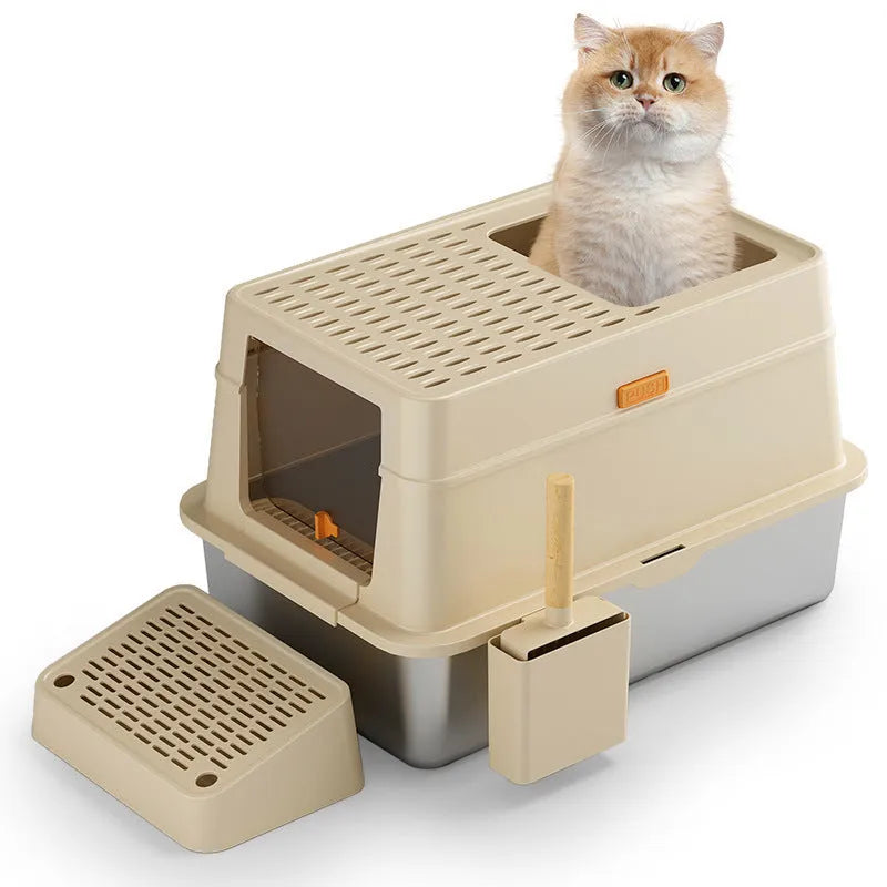 Grey enclosed cat litter box with a front pedal and removable top lid.