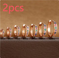 Geometric perforated stud earrings with circle zircon decoration in gold, rose gold and silver colours