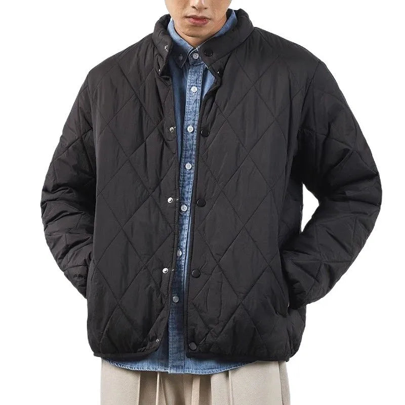 Men's black diamond lattice quilted winter jacket with extended length showing loose fit design