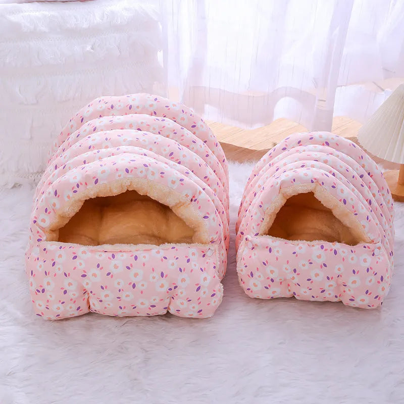 Enclosed winter cat bed with a removable cover in a floral pattern, shown in small and medium sizes.