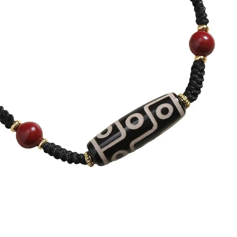 Tibetan agate dzi bead bracelet with adjustable shrinkable fit showing natural stone beads