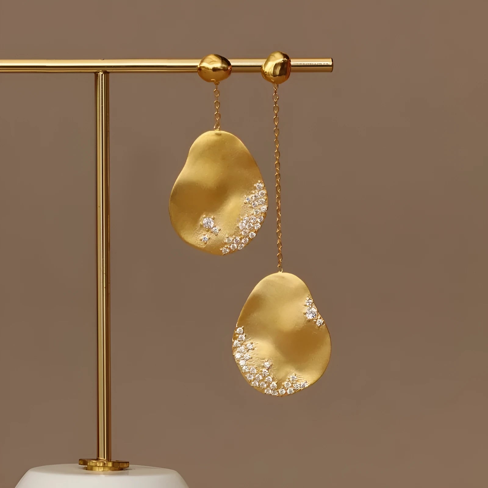 Asymmetric floral women's earrings with zircon stones in gold or silver finish, Chinese style design.