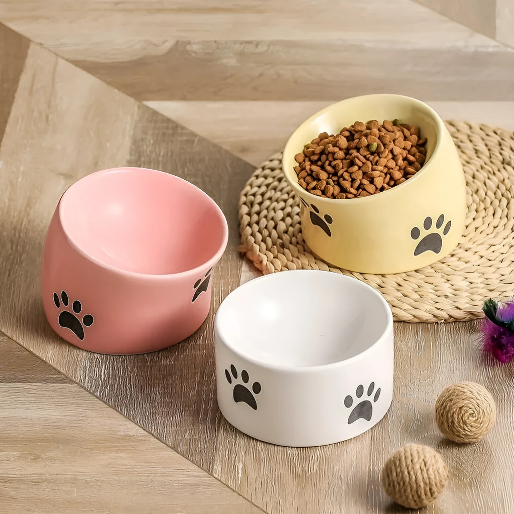 Ceramic cat food bowl with high foot and cat's paw pattern in chosen colour