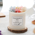 Dried flower romantic scented candle in gift box with chip wood base.