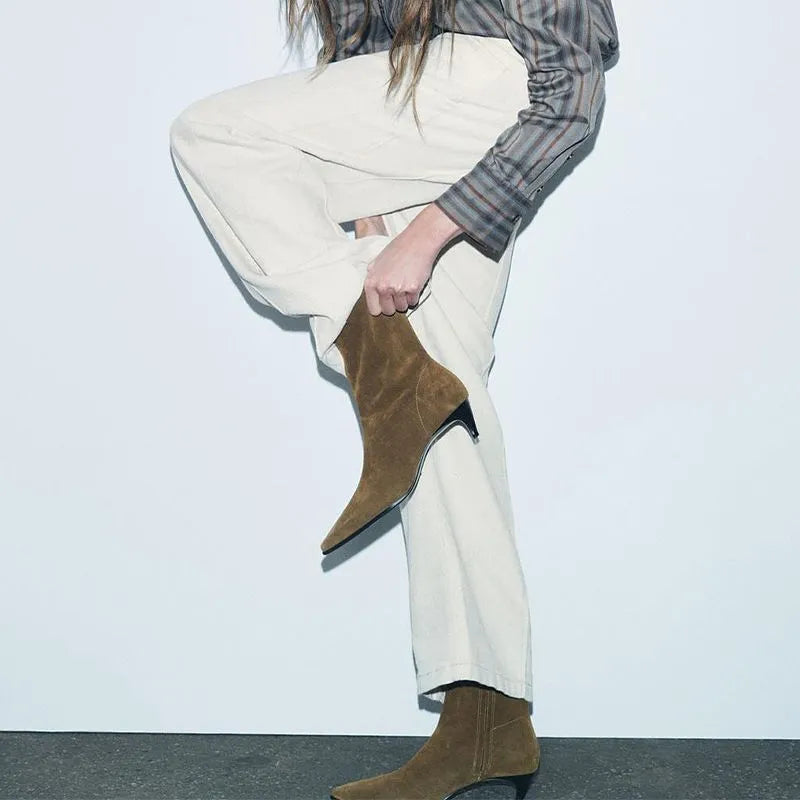 Brown square toe retro ankle boots with a side zip and a kitten heel on a waterproof platform sole.