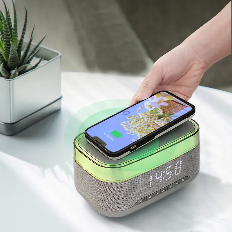 White multifunctional alarm clock with Bluetooth speaker, wireless charging pad, and night light display