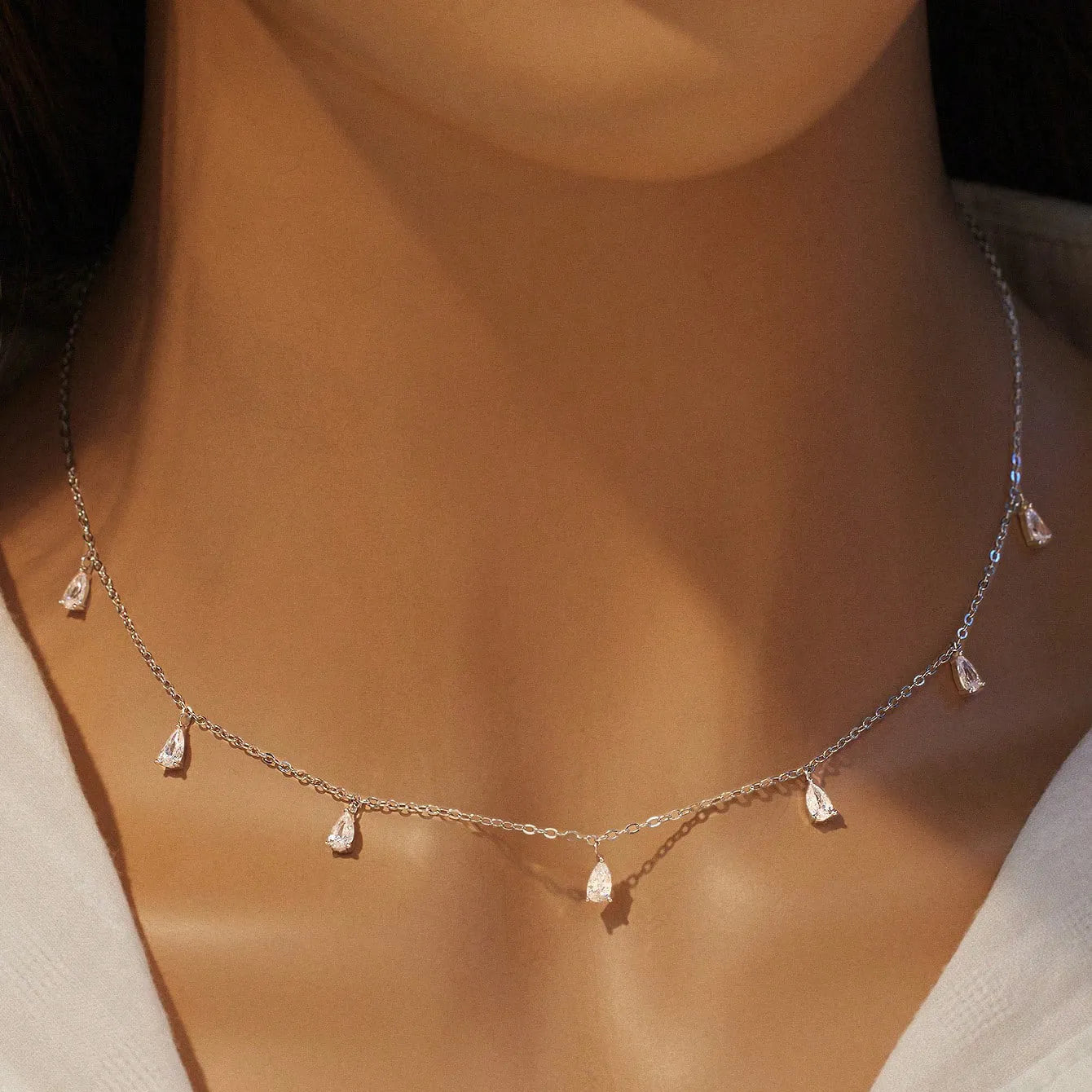 925 silver drop-shaped artificial zircon necklace on an adjustable O-chain, shown in silver, rose gold, and golden yellow finishes.